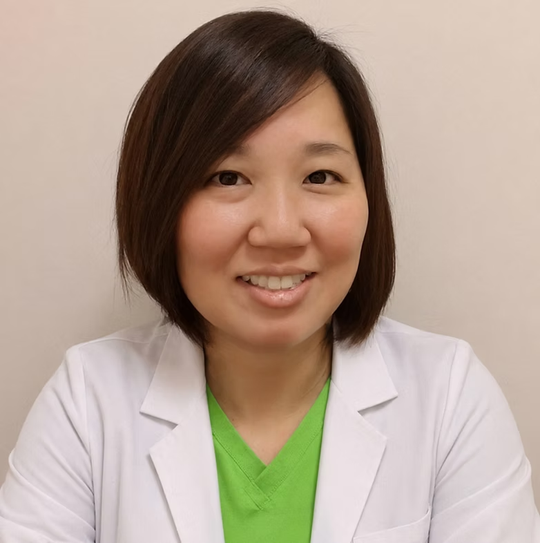 Portrait of Janny Cho, RDN, wearing a white coat